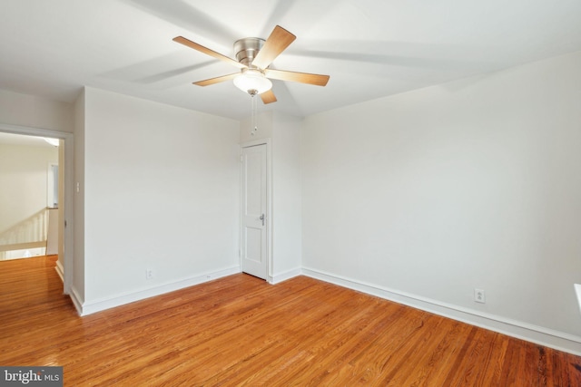 unfurnished room with light wood-type flooring and ceiling fan