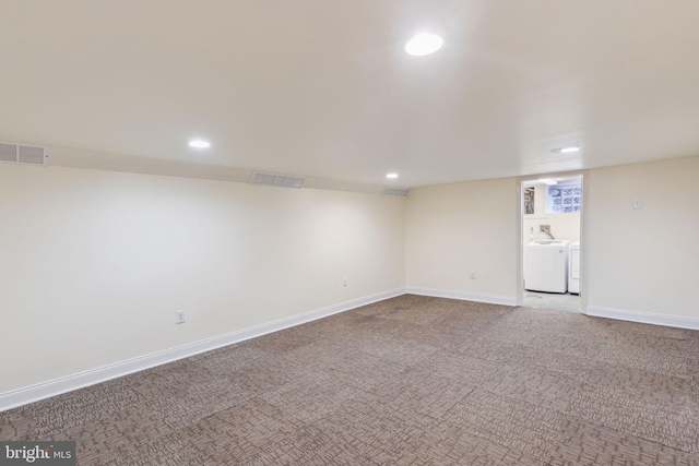 empty room with carpet flooring and independent washer and dryer