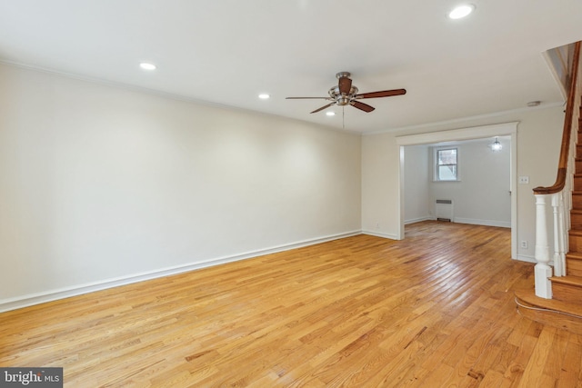 unfurnished living room with ceiling fan, light hardwood / wood-style floors, and ornamental molding