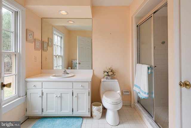 bathroom with a shower with door and a wealth of natural light