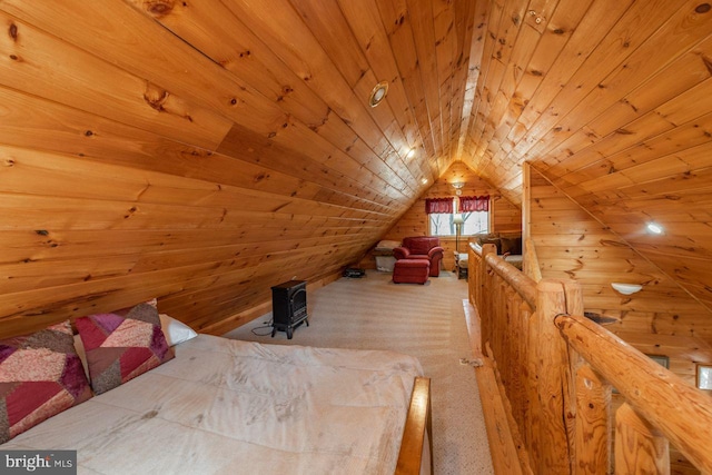 unfurnished bedroom featuring wood walls, carpet, wood ceiling, and lofted ceiling