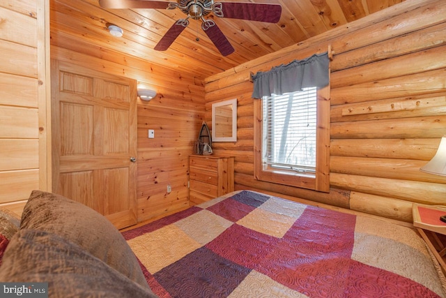 bedroom featuring rustic walls, ceiling fan, and wood ceiling