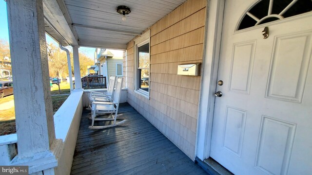 wooden terrace with covered porch