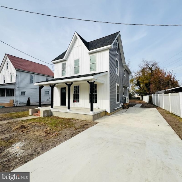 modern inspired farmhouse featuring covered porch