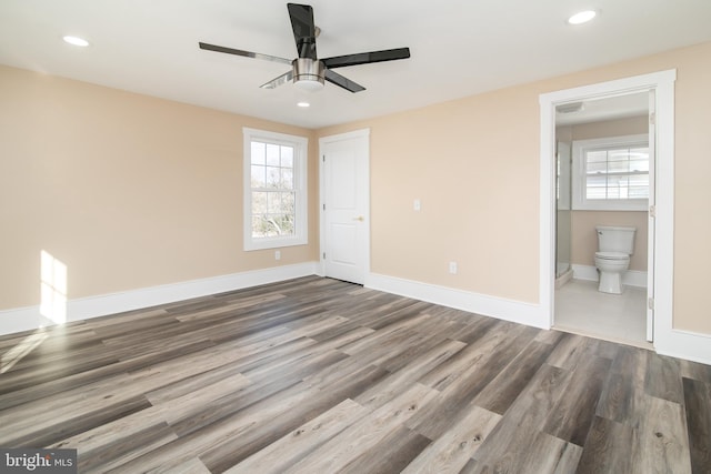 empty room featuring hardwood / wood-style flooring and ceiling fan