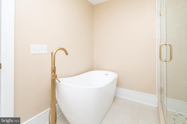 bathroom featuring tile patterned flooring and plus walk in shower