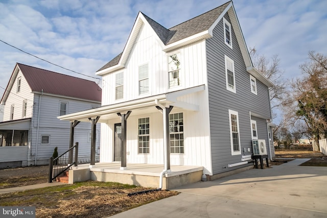 modern farmhouse with ac unit and covered porch