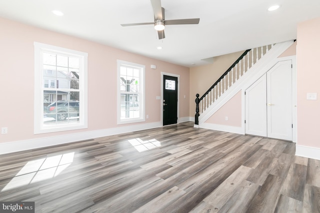 entryway featuring ceiling fan and hardwood / wood-style flooring