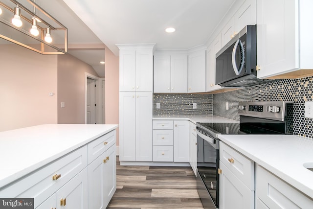 kitchen featuring white cabinets, light wood-type flooring, and appliances with stainless steel finishes