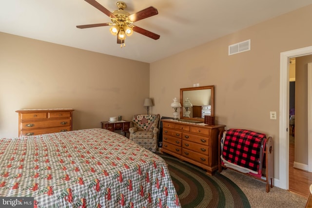 carpeted bedroom featuring ceiling fan