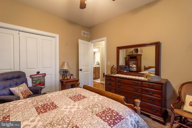 bedroom with hardwood / wood-style flooring, a closet, and ceiling fan