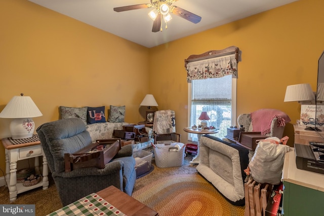 carpeted living room with ceiling fan