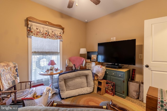 living room with carpet and ceiling fan