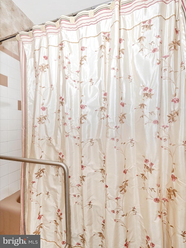 bathroom with a shower with curtain