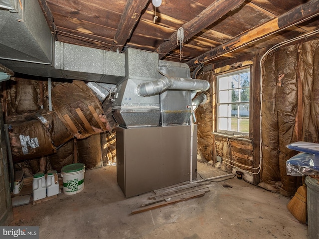 utility room featuring heating unit