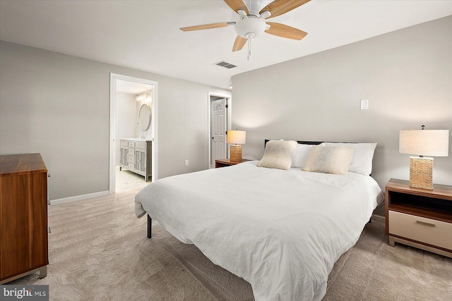 bedroom with carpet flooring, connected bathroom, and ceiling fan