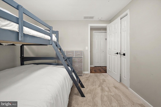 unfurnished bedroom featuring light colored carpet