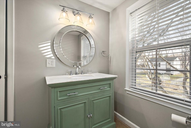 bathroom featuring vanity and a wealth of natural light