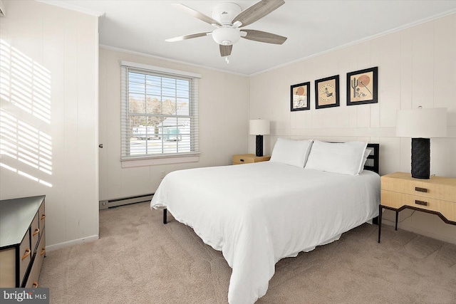 carpeted bedroom featuring ceiling fan, crown molding, and a baseboard heating unit