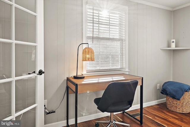 office space featuring crown molding, plenty of natural light, wood-type flooring, and wooden walls