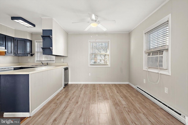 kitchen with ceiling fan, baseboard heating, ventilation hood, crown molding, and light hardwood / wood-style floors