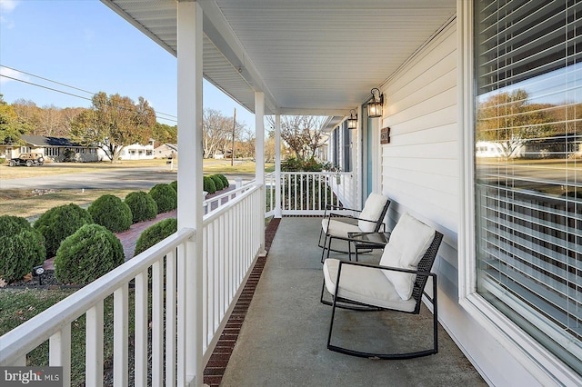 balcony featuring a porch