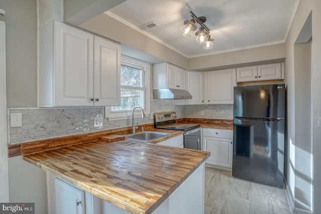 kitchen featuring white cabinets, black fridge, and stainless steel range with electric stovetop