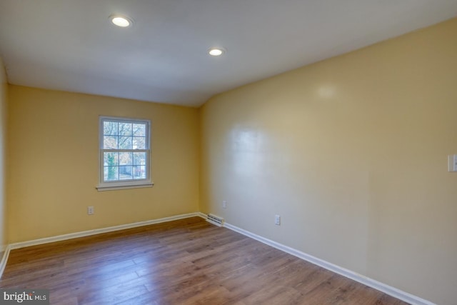 spare room with light hardwood / wood-style floors