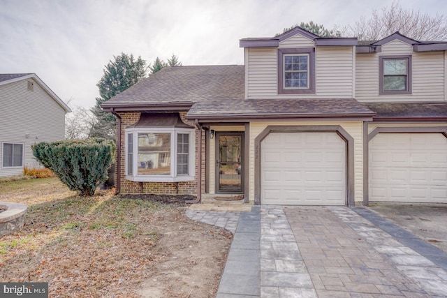 view of front of property with a garage