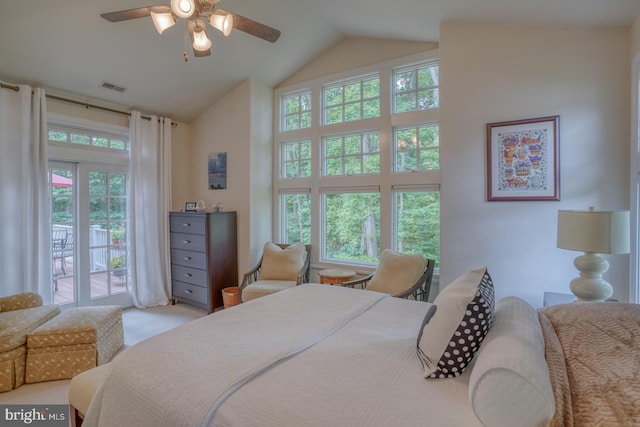 carpeted bedroom with access to outside, multiple windows, ceiling fan, and vaulted ceiling