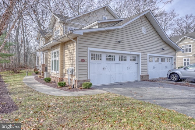 view of side of home with a garage