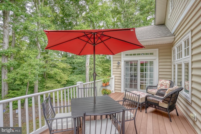 wooden deck with outdoor lounge area