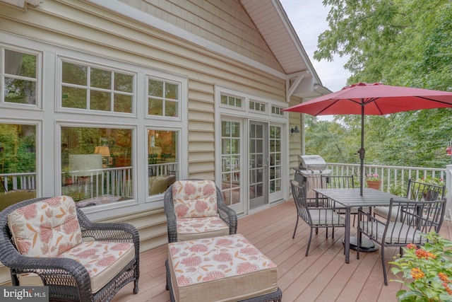 wooden terrace featuring a grill