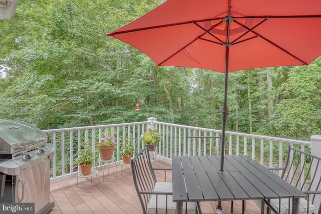 wooden deck featuring grilling area