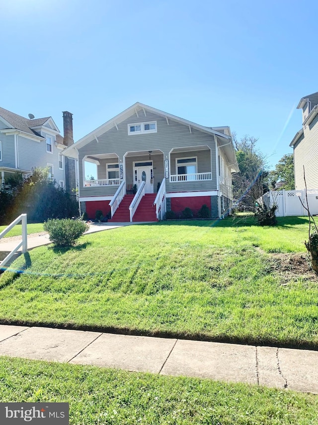 view of front of property with a front lawn and a porch