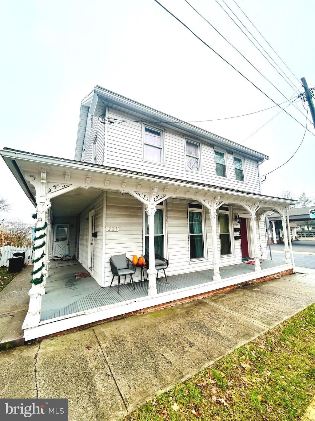 back of property featuring covered porch