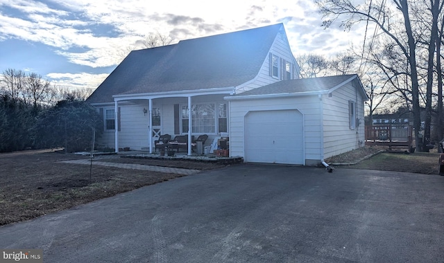 view of front of property with a porch and a garage