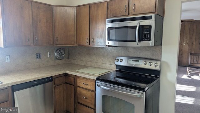 kitchen featuring appliances with stainless steel finishes and backsplash