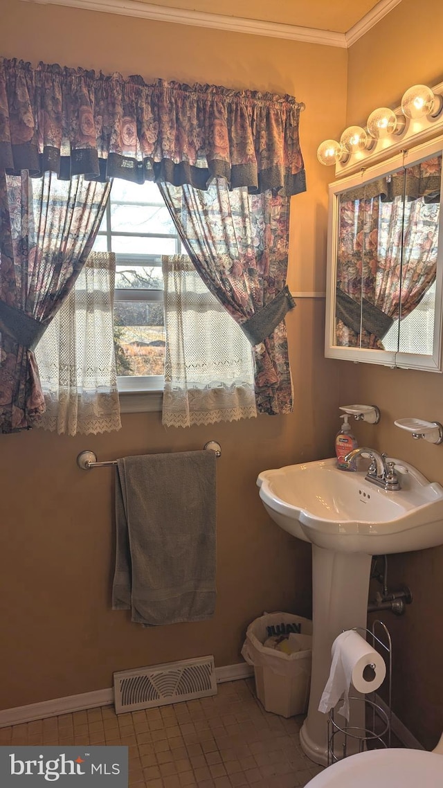 bathroom with tile patterned floors