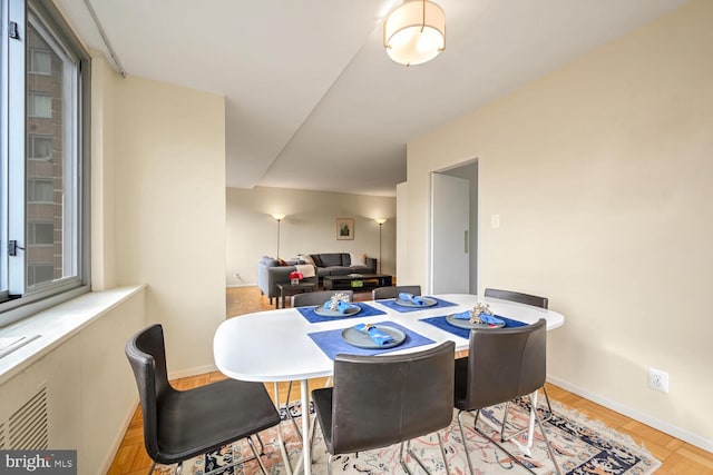 dining space featuring light hardwood / wood-style floors