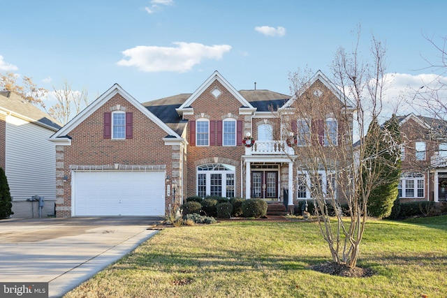 view of property featuring a front lawn and a garage