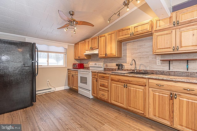 kitchen with white range with electric stovetop, tasteful backsplash, lofted ceiling, sink, and black fridge