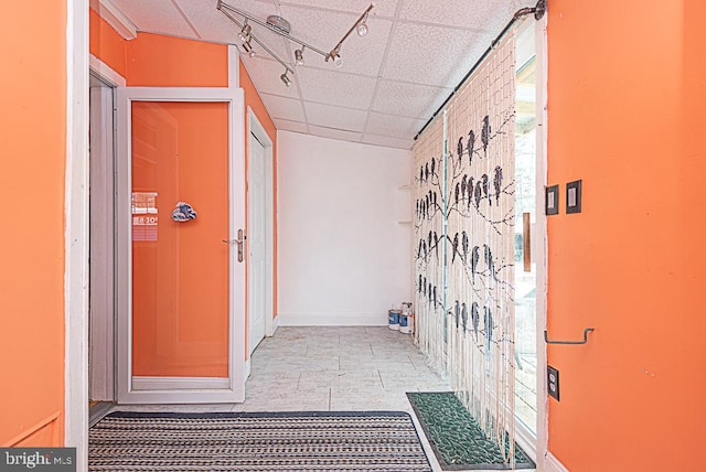 bathroom featuring a paneled ceiling