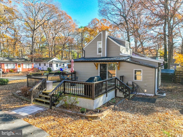 rear view of house with a deck