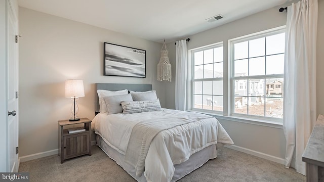 bedroom with light colored carpet