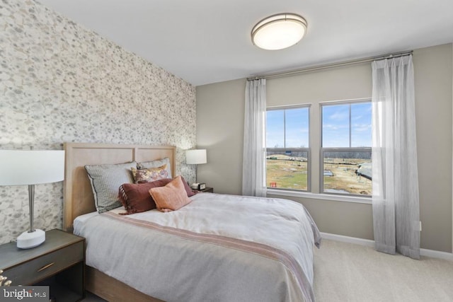 bedroom featuring light colored carpet