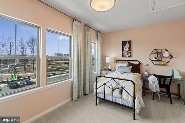 bedroom featuring light colored carpet