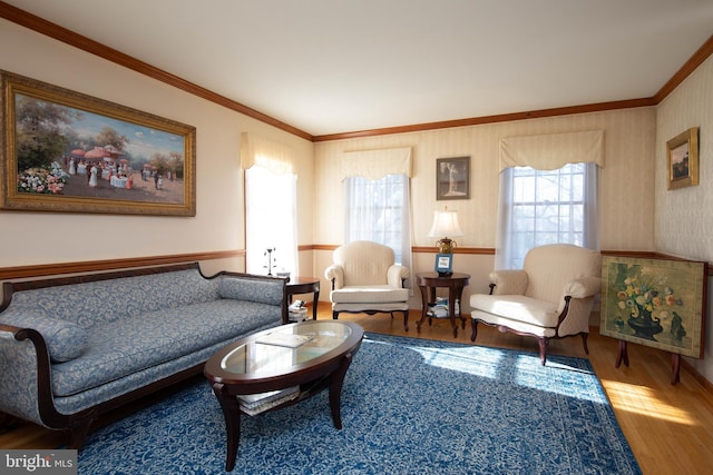 living room with hardwood / wood-style flooring and ornamental molding