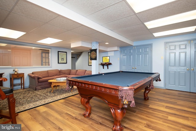 rec room with hardwood / wood-style floors, a drop ceiling, and billiards