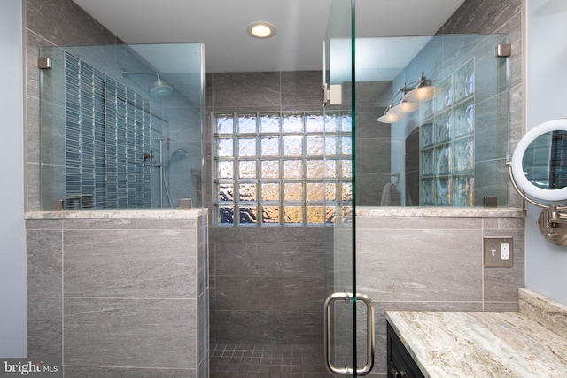 bathroom featuring vanity and walk in shower